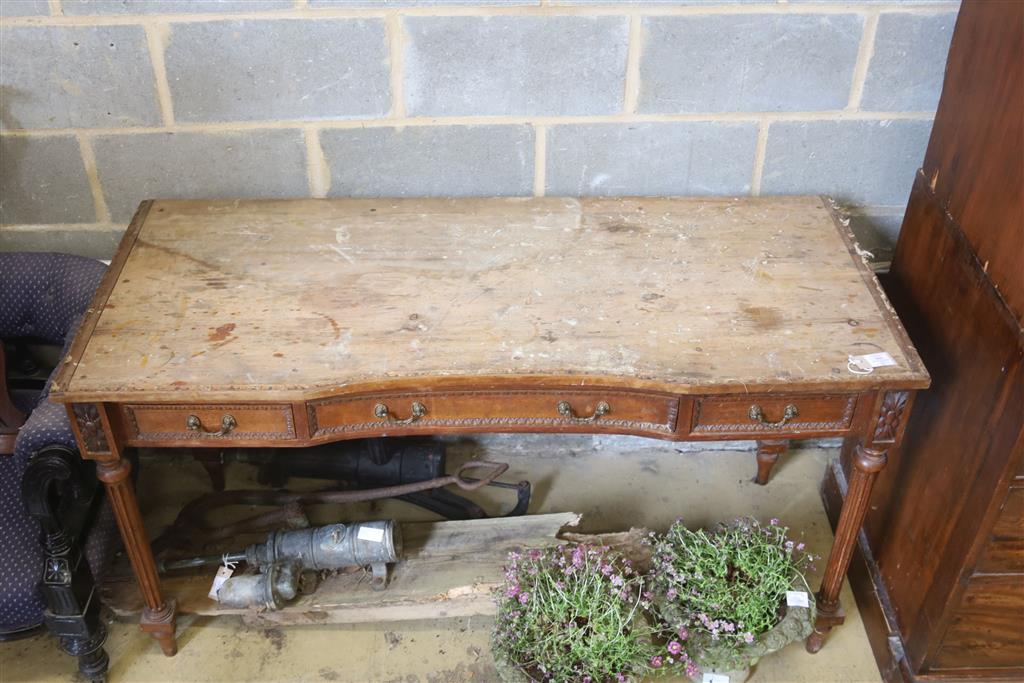 A French walnut dressing table, width 143cm, depth 59cm, height 79cm (a.f.)